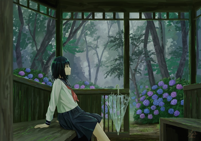 Girl in school uniform sitting in a gazebo during rain