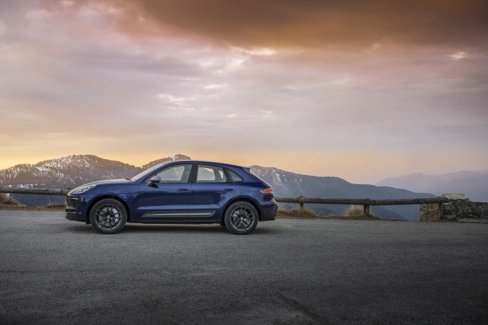 Blue Porsche Macan Turbo on mountain road