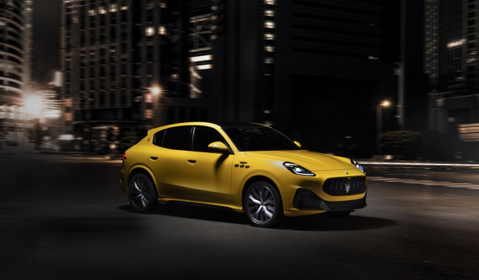 Yellow Maserati Grecale Trofeo driving at night