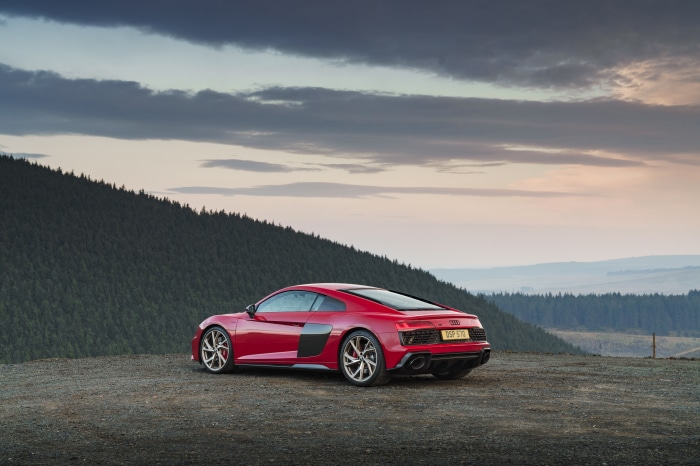 Red Audi R8 V10 parked on a gravel overlook