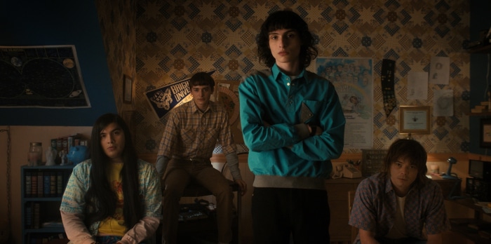 Stranger Things characters in a room