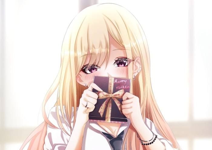 Marin Kitagawa from My Dress-Up Darling holding a birthday card