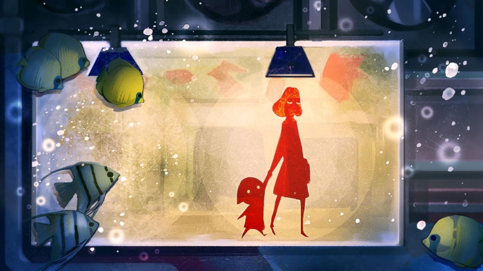 Mother and child observing fish in an aquarium