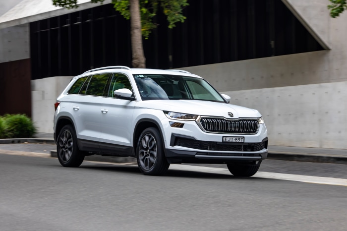 White Skoda Kodiaq driving on a street