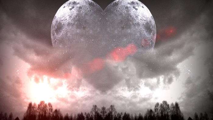 Heart-shaped moon over silhouetted trees