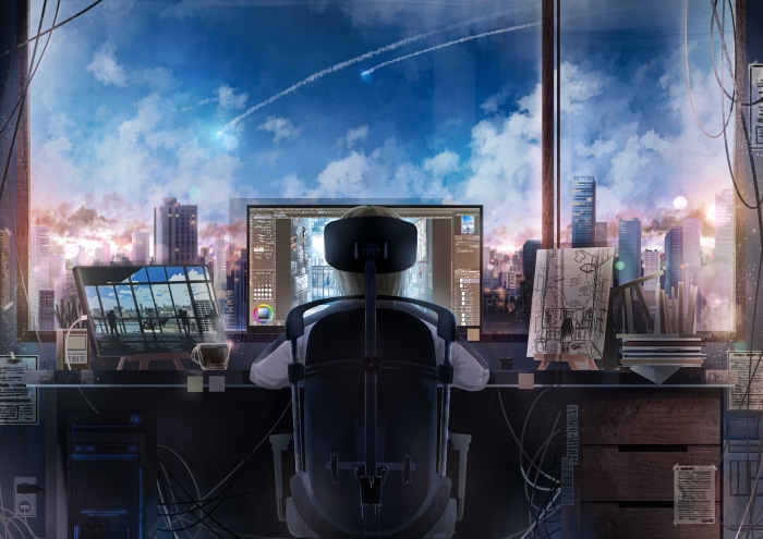 Person working on computer with city view