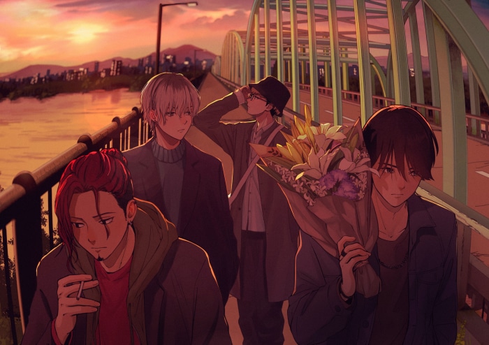 Four friends walking on a bridge at sunset