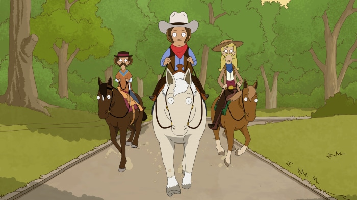 Three people on horses in Central Park