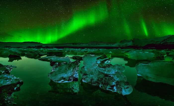 Aurora Borealis over icebergs in Iceland at night