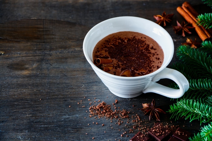 Hot Chocolate in a White Cup with Cinnamon and Star Anise