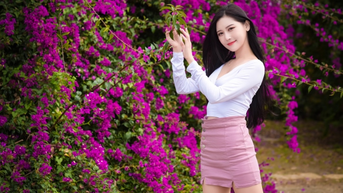 Asian Woman Posing with Purple Flowers 4K