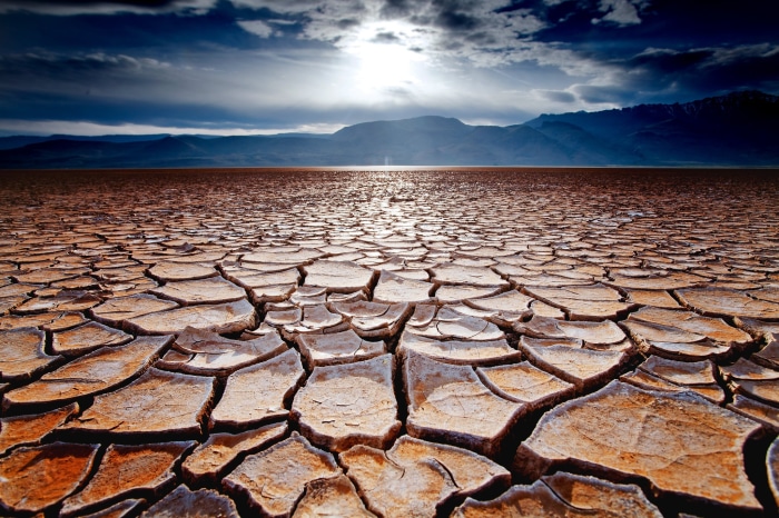 Cracked desert landscape under a dramatic sky