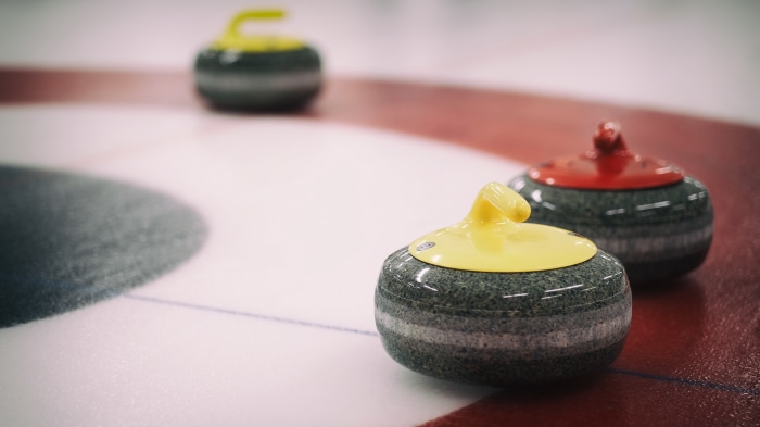 Curling stones on ice