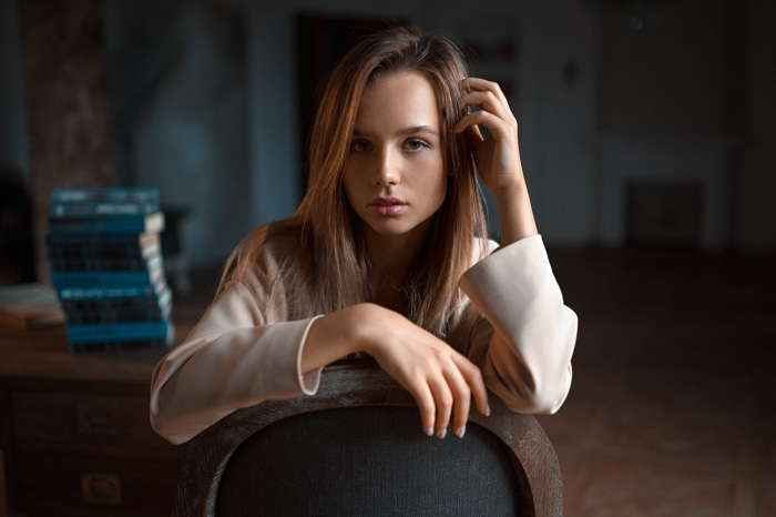 Young woman sitting on a chair indoors