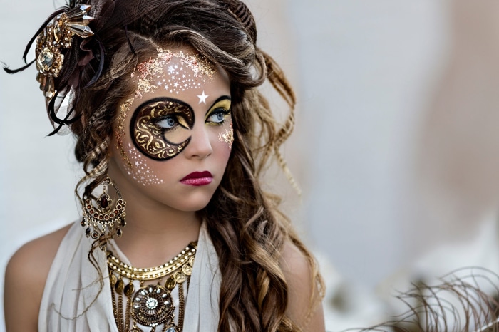 Girl with carnival makeup and jewelry