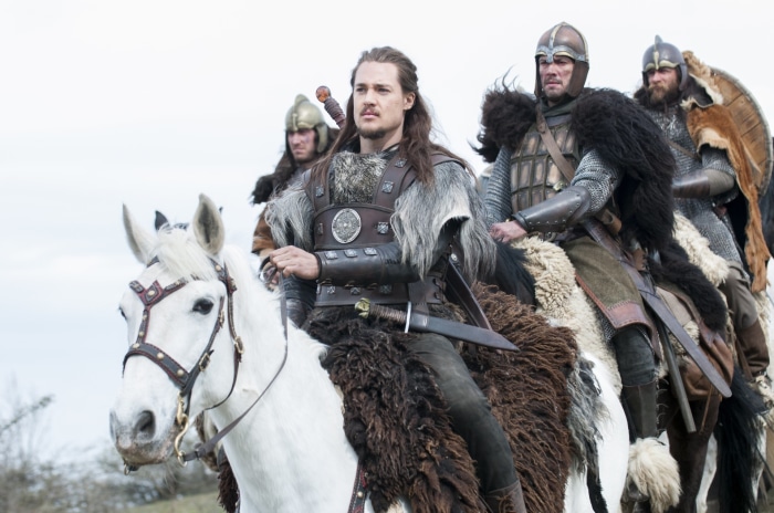 Uhtred and warriors on horseback from The Last Kingdom
