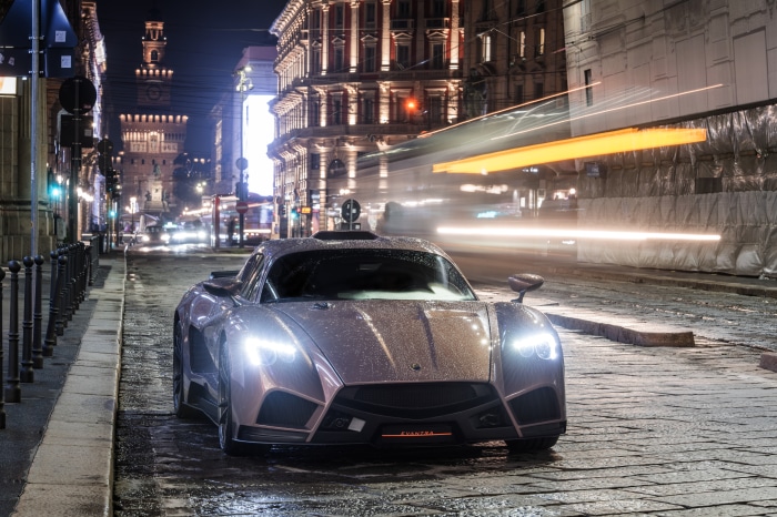Mazzanti Evantra sports car on a wet city street at night