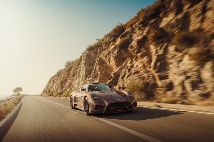 Mazzanti Evantra 4K driving on a coastal road