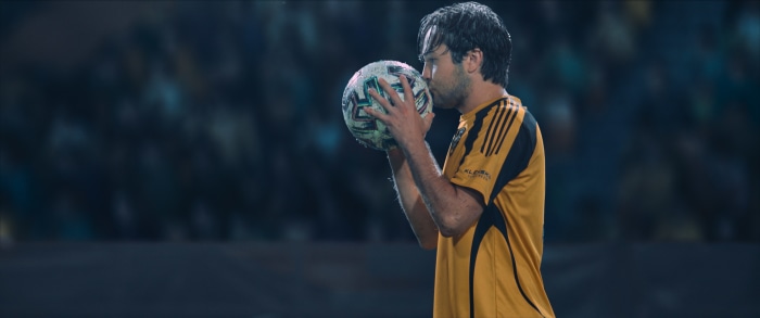 Taylor Gray kissing a soccer ball