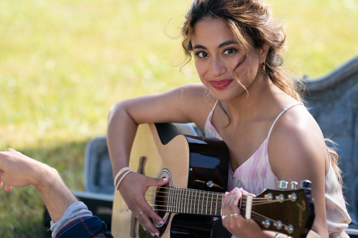 Ally Brooke playing guitar outdoors