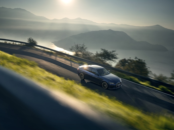 Alpina B4 Gran Coupé driving on mountain road