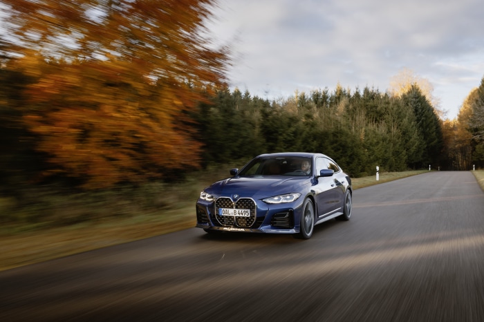 Alpina B4 Gran Coupé driving on a road