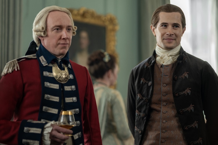 Two men in 18th-century attire in a room