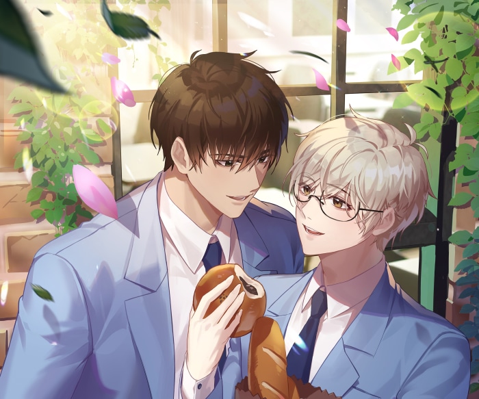Two young men in blue suits holding bread