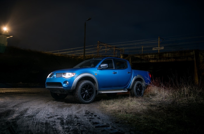 Blue Mitsubishi L200 HD pickup truck at night