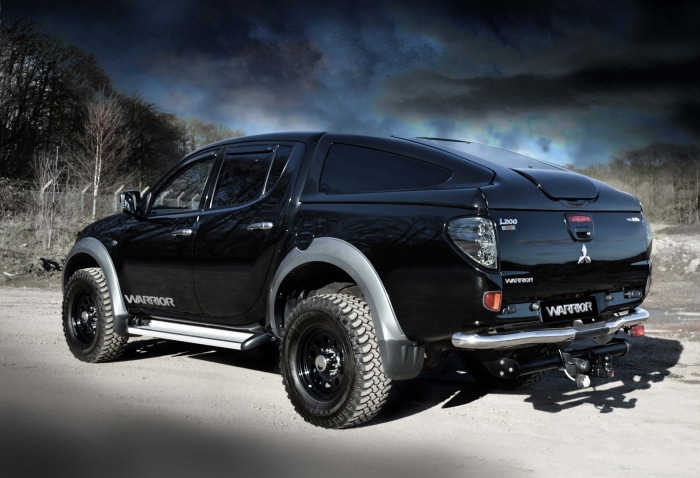 Black Mitsubishi L200 Warrior pickup truck with canopy
