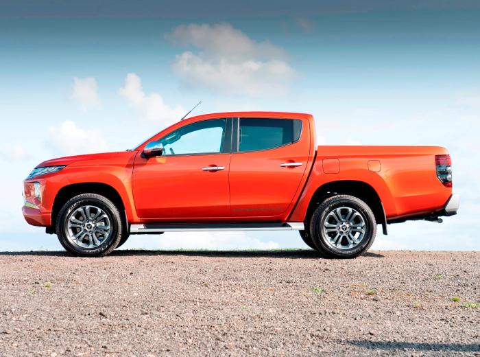 Orange Mitsubishi L200 Barbarian X pickup truck