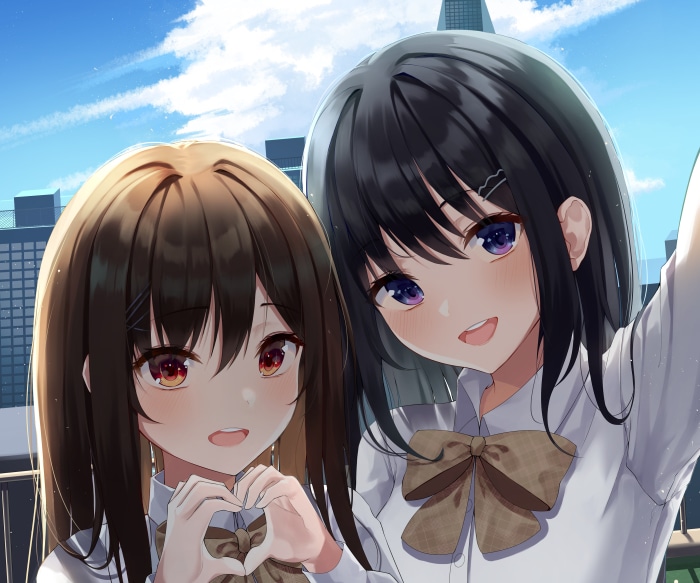 Two girls taking a selfie outdoors