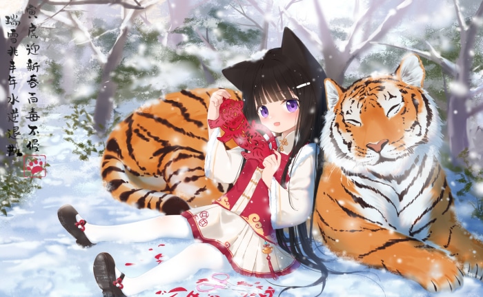 Girl with tigers in snowy forest