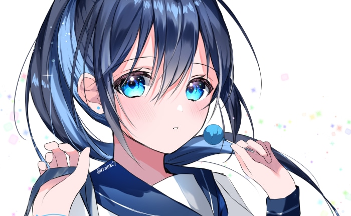 Girl with blue eyes holding a lollipop