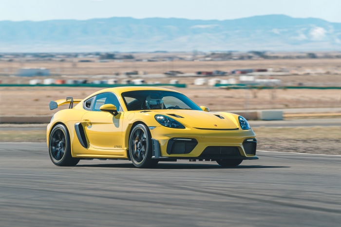 Yellow Porsche 718 Cayman GT4 RS on a Racetrack 4K