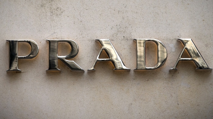 Prada logo on a textured wall