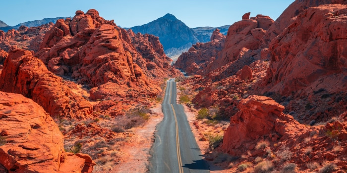Road through red rock formations in Valley of Fire State Park
