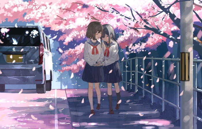 Two schoolgirls in uniform under cherry blossoms