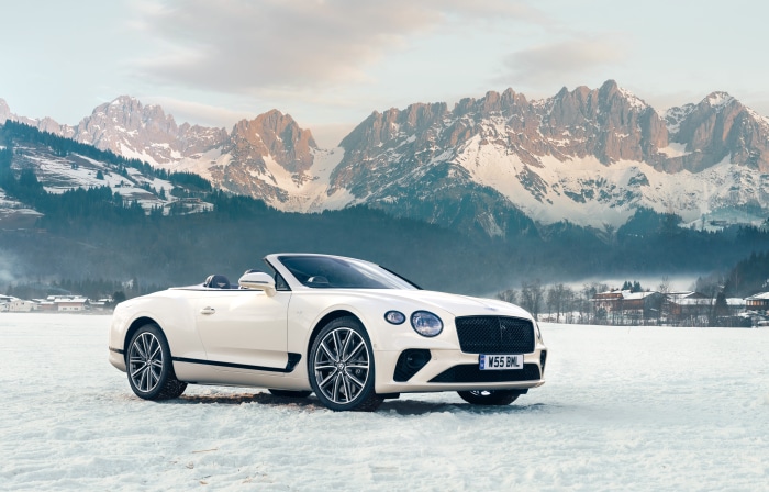 Bentley Continental GT V8 Convertible in snowy mountains 4K