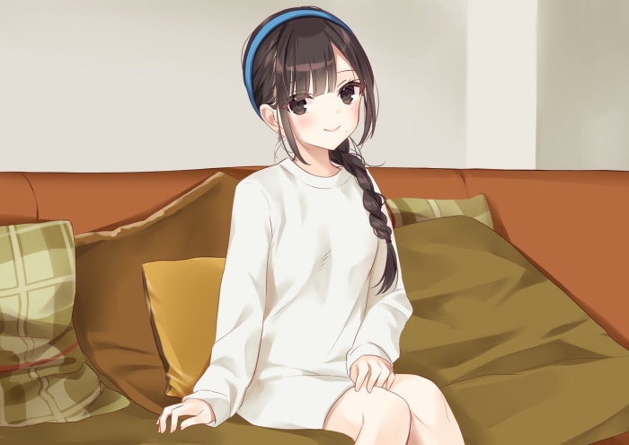 Girl with braided hair wearing a white sweater