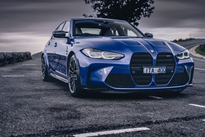 Blue BMW M3 on a Road