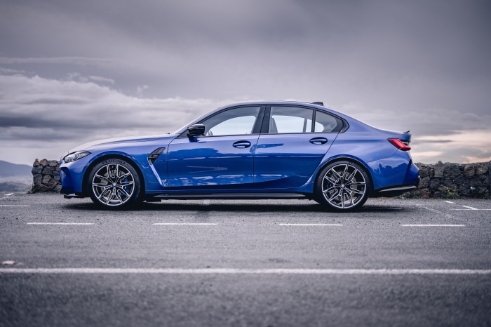 Blue BMW M3 Sedan on Road