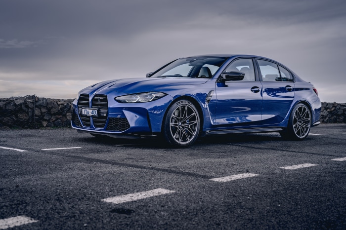 Blue BMW M3 Sedan on Paved Surface