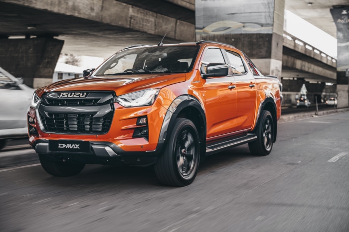 Orange Isuzu D-Max V-Cross 4x4 Double Cab driving