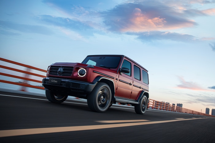 Mercedes-Benz G-Class driving on a bridge at sunset