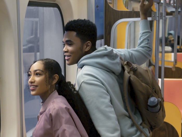 Elsa from Sneakerella and Chosen Jacobs on a train