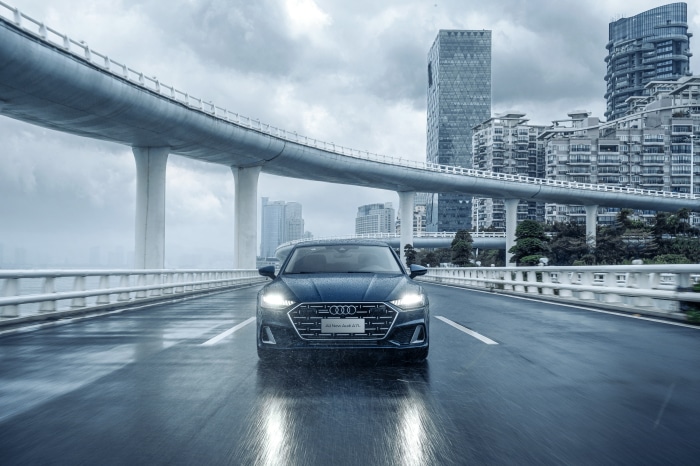 Audi A7L 55 TFSI quattro S line on wet road
