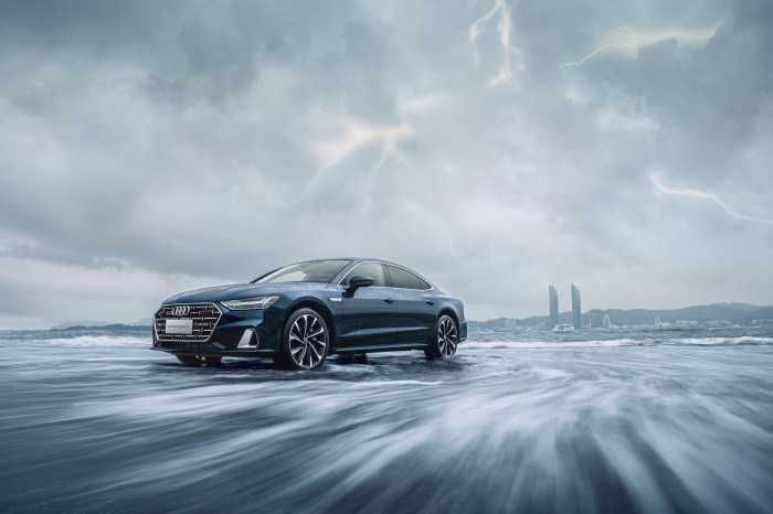 Audi A7L 55 TFSI quattro S line on a stormy beach