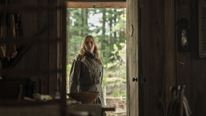 Jodie Comer from Killing Eve in a cabin