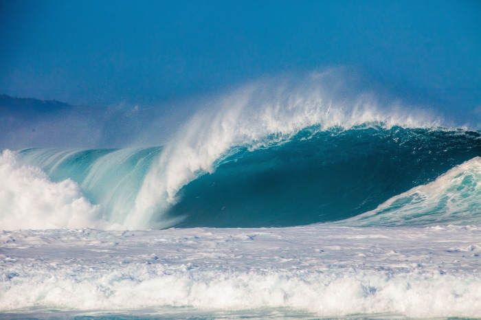 Massive ocean wave breaking in blue water 4K